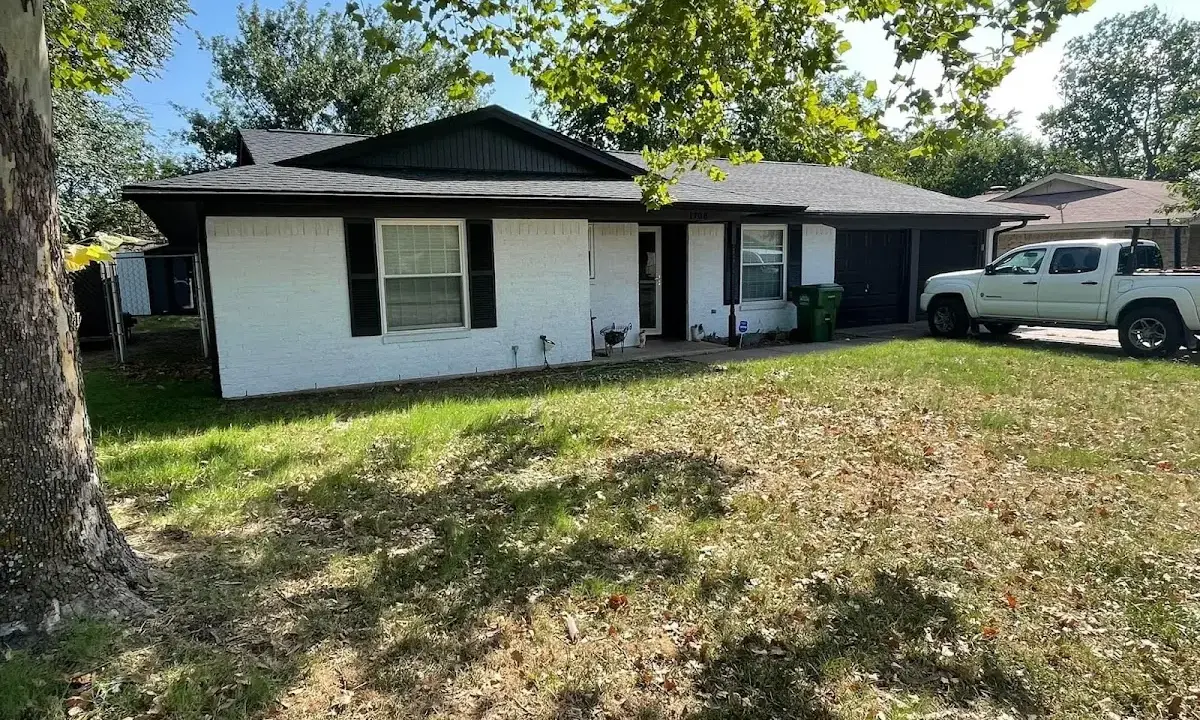 Professional roofing crew working on a residential roof in Madison